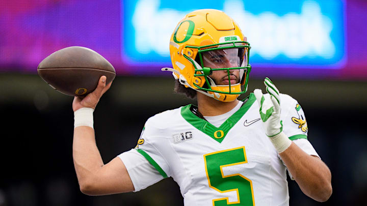 Oregon quarterback Dante Moore warms up as the Oregon Ducks take on the Washington Huskies on Nov. 29, 2025, at Husky Stadium in Seattle, Washington.
