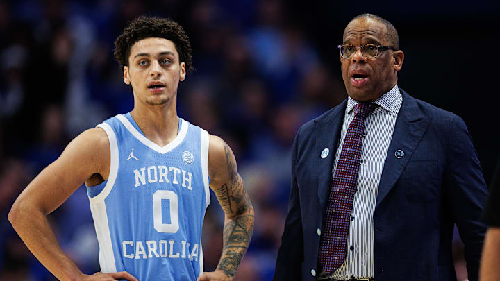 Dec 2, 2025; Lexington, Kentucky, USA; North Carolina Tar Heels head coach Hubert Davis talks with guard Kyan Evans (0) during the second half against the Kentucky Wildcats at Rupp Arena at Central Bank Center. Mandatory Credit: Jordan Prather-Imagn Images