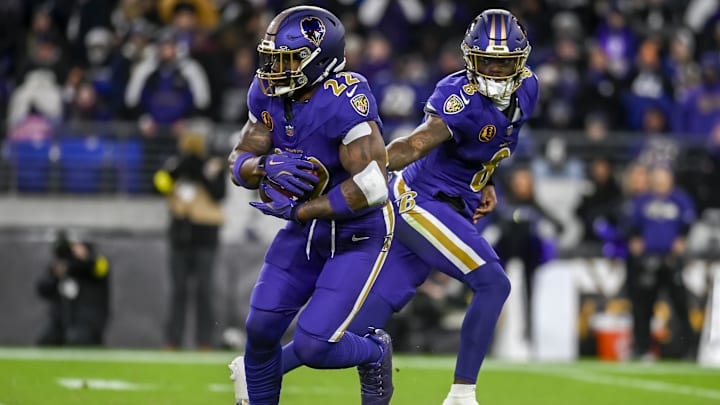 Nov 27, 2025; Baltimore, Maryland, USA;  Baltimore Ravens quarterback Lamar Jackson (8) hands off to running back Derrick Henry (22) during the first half against the Cincinnati Bengals at M&T Bank Stadium. Mandatory Credit: Tommy Gilligan-Imagn Images