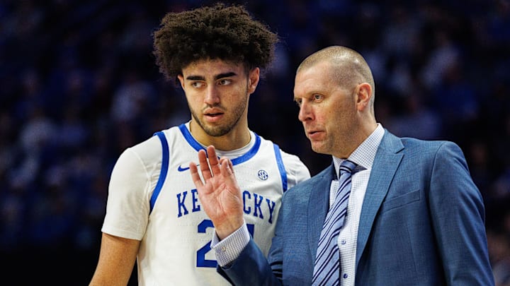Dec 23, 2025; Lexington, Kentucky, USA; Kentucky Wildcats head coach Mark Pope talks with center Malachi Moreno (24) during the second half against the Bellarmine Knights at Rupp Arena at Central Bank Center. Mandatory Credit: Jordan Prather-Imagn Images