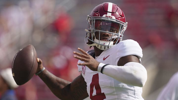 Sep 14, 2024; Madison, Wisconsin, USA;  Alabama Crimson Tide quarterback Jalen Milroe (4) throws a pass during warmups prior to the game against the Wisconsin Badgers at Camp Randall Stadium. Mandatory Credit: Jeff Hanisch-Imagn Images