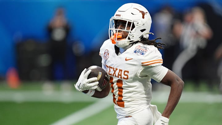 Jan 1, 2025; Atlanta, GA, USA; Texas Longhorns wide receiver Silas Bolden (11) returns a punt for a touchdown against the Arizona State Sun Devils during the first half of the Peach Bowl at Mercedes-Benz Stadium. Mandatory Credit: Dale Zanine-Imagn Images
