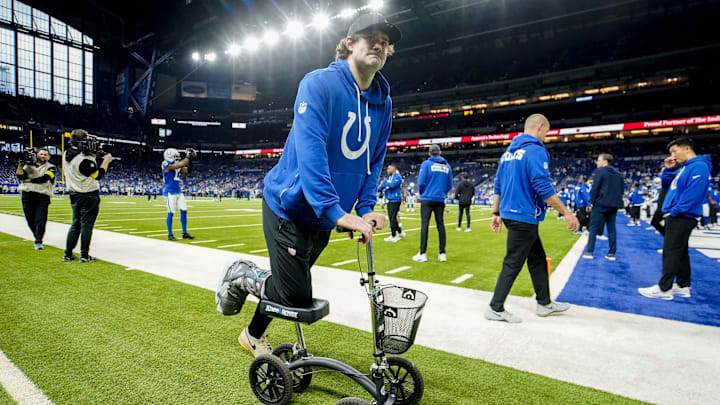 Indianapolis Colts quarterback Daniel Jones moves along the sideline on a scooter Sunday, Dec. 28, 2025, ahead a game against the Jacksonville Jaguars at Lucas Oil Stadium in Indianapolis.