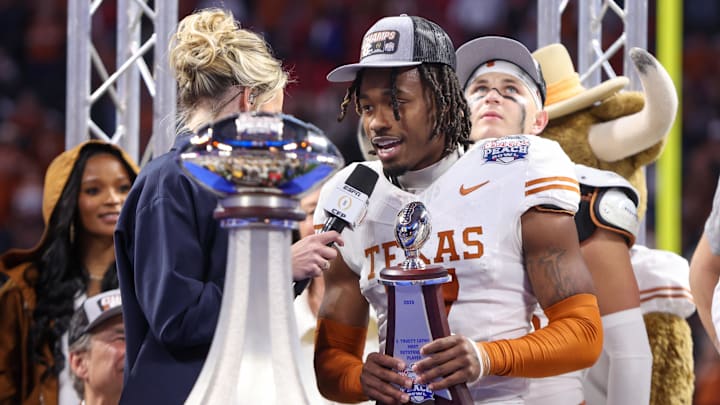 Jan 1, 2025; Atlanta, GA, USA; Texas Longhorns defensive back Jahdae Barron (7) receives the most outstanding player award after a victory over the Arizona State Sun Devils in the Peach Bowl at Mercedes-Benz Stadium. Mandatory Credit: Brett Davis-Imagn Images
