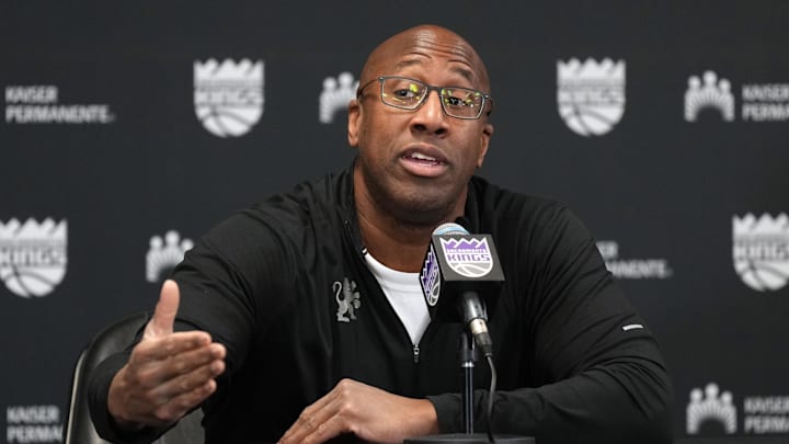 Dec 8, 2024; Sacramento, California, USA; Sacramento Kings head coach Mike Brown talks to media members before the game against the Utah Jazz at Golden 1 Center. Mandatory Credit: Darren Yamashita-Imagn Images
