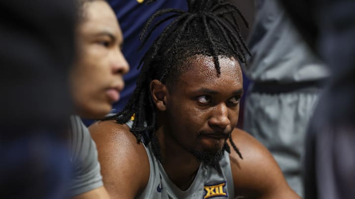 Jan 13, 2026; Houston, Texas, USA; West Virginia Mountaineers guard Chance Moore (13) and  forward Jackson Fields (15) listen to the coach during a time out against the Houston Cougars  in the first half at Fertitta Center. Mandatory Credit: Thomas Shea-Imagn Images