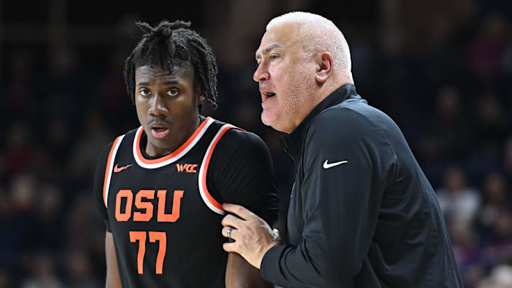 Jan 28, 2025; Spokane, Washington, USA; Oregon State Beavers head coach Wayne Tinkle, right talks with Oregon State Beavers forward Maxim Logue (77) during a game against the Gonzaga Bulldogs in the second half at McCarthey Athletic Center. Mandatory Credit: James Snook-Imagn Images Jan 28, 2025; Spokane, Washington, USA; Oregon State Beavers head coach Wayne Tinkle, right talks with Oregon State Beavers forward Maxim Logue (77) during a game against the Gonzaga Bulldogs in the second half at McCarthey Athletic Center. Mandatory Credit: James Snook-Imagn Images
