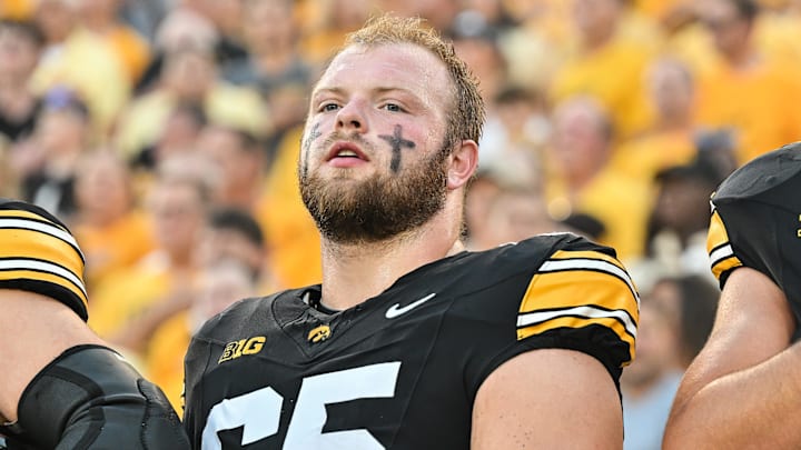 Sep 13, 2025; Iowa City, Iowa, USA; Iowa Hawkeyes offensive lineman Logan Jones (65) looks on before the game against the Massachusetts Minutemen at Kinnick Stadium. Mandatory Credit: Jeffrey Becker-Imagn Images