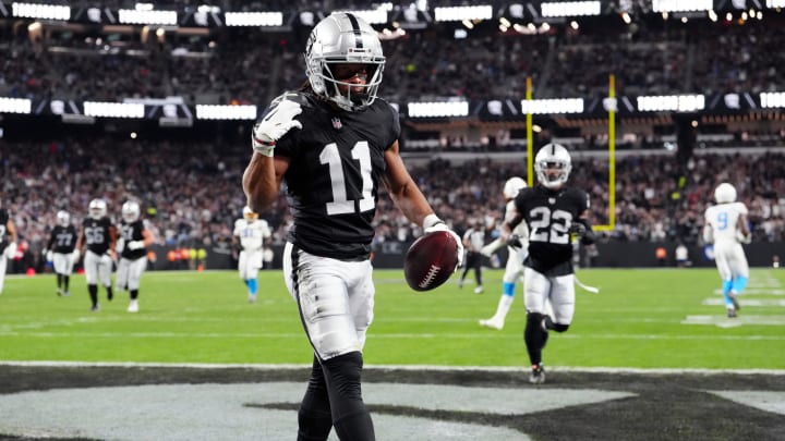 Dec 14, 2023; Paradise, Nevada, USA; Las Vegas Raiders wide receiver Tre Tucker (11) celebrates after a turnover against the Los Angeles Chargers in the second quarter at Allegiant Stadium. Mandatory Credit: Stephen R. Sylvanie-USA TODAY Sports