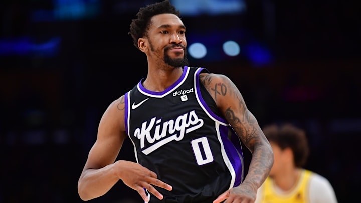 Mar 6, 2024; Los Angeles, California, USA;  Sacramento Kings guard Malik Monk (0) reacts after scoring a three point basket against the against the Los Angeles Lakers during the second half at Crypto.com Arena. Mandatory Credit: Gary A. Vasquez-Imagn Images