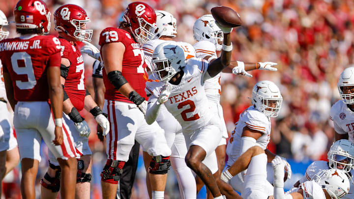 Texas Longhorns defensive back Derek Williams Jr. (2) recovers a fumble during the second quarter against the Oklahoma Sooners at the Cotton Bowl. Texas Longhorns defensive back Derek Williams Jr. (2) recovers a fumble during the second quarter against the Oklahoma Sooners at the Cotton Bowl.