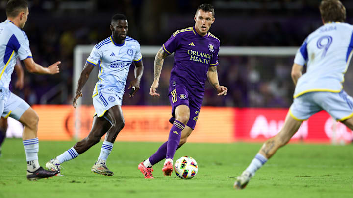 Oct 19, 2024; Orlando, Florida, USA; Orlando City defender Kyle Smith (24) controls the ball against Atlanta United in the second half at Inter&Co Stadium. Mandatory Credit: Nathan Ray Seebeck-Imagn Images