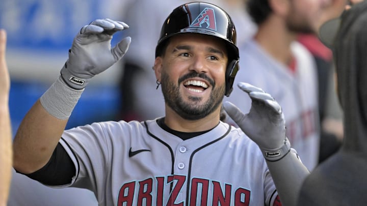 Jul 12, 2025; Anaheim, California, USA;  Arizona Diamondbacks third baseman Eugenio Suarez (28) celebrates in the dugout after his second solo home run of the game during the fourth inning against the Los Angeles Angels at Angel Stadium. Mandatory Credit: Jayne Kamin-Oncea-Imagn Images
