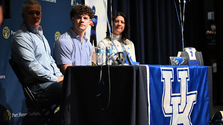 Port Huron Northern football's Lincoln Watkins (center) is seen with his parents, TJ and Jeanne, before his signing his letter-of-intent to the University of Kentucky during a ceremony at Northern High School in Port Huron on Friday, Dec. 5, 2025. Port Huron Northern football's Lincoln Watkins (center) is seen with his parents, TJ and Jeanne, before his signing his letter-of-intent to the University of Kentucky during a ceremony at Northern High School in Port Huron on Friday, Dec. 5, 2025.