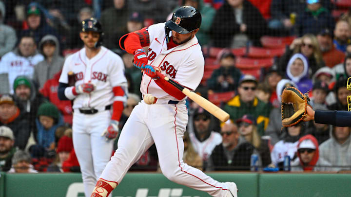 Apr 8, 2026; Boston, Massachusetts, USA; Boston Red Sox right fielder Wilyer Abreu (52) hits a single against the Milwaukee Brewers during the seventh inning at Fenway Park. Mandatory Credit: Eric Canha-Imagn Images