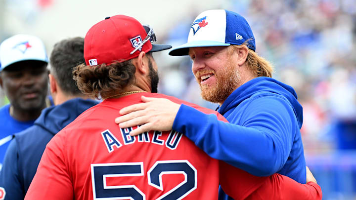 Mar 22, 2024; Dunedin, Florida, USA; Toronto Blue Jays designated hitter Justin Turner (2) talks with Boston Red Sox right fielder Wilyer Abreu (52) before the start of the spring training game at TD Ballpark. Mandatory Credit: Jonathan Dyer-Imagn Images
