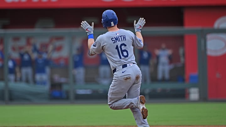 Kansas City, Missouri, USA; Los Angeles Dodgers catcher Will Smith (16) waves to the Dodgers bullpen after hitting a solo home run in the sixth inning against the Kansas City Royals at Kauffman Stadium.