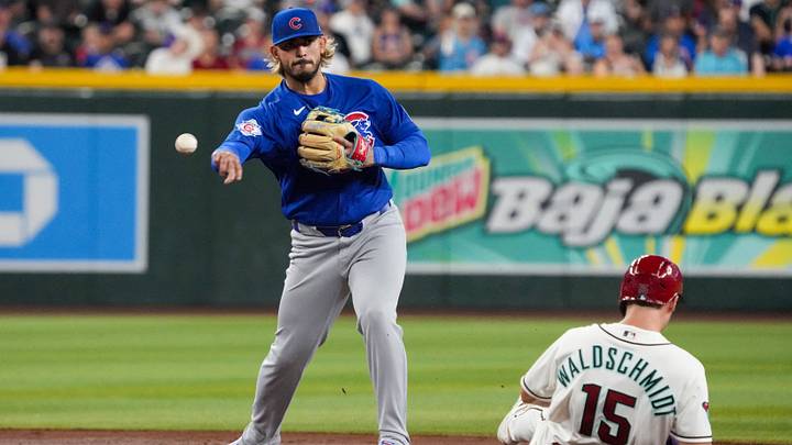 Aug 26, 2026: Chicago Cubs second baseman Gabriel Arias (43) turns the double play while avoiding Arizona Diamondbacks center fielder Ryan Waldschmidt (15) in the third inning at Chase Field. Credit: Rick Scuteri-Imagn Images Aug 26, 2026: Chicago Cubs second baseman Gabriel Arias (43) turns the double play while avoiding Arizona Diamondbacks center fielder Ryan Waldschmidt (15) in the third inning at Chase Field. Credit: Rick Scuteri-Imagn Images
