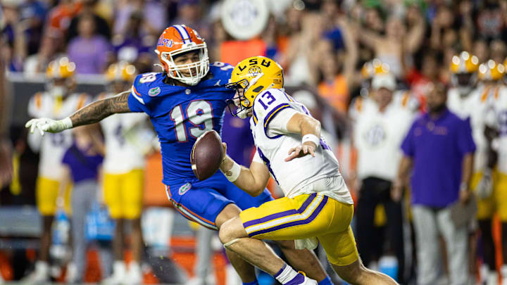 Nov 16, 2024; Gainesville, Florida, USA; Florida Gators defensive end T.J. Searcy (19) chases LSU Tigers quarterback Garrett Nussmeier (13) during the second half at Ben Hill Griffin Stadium. Mandatory Credit: Matt Pendleton-Imagn Images