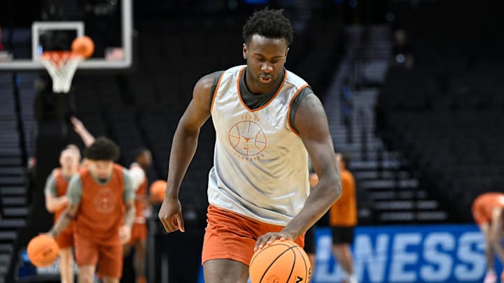 Mar 18, 2026; Portland, OR, USA; Texas Longhorns forward Declan Duru Jr. (4) dribbles the ball during a practice session ahead of the first round of the men's 2026 NCAA Tournament at Moda Center. Mandatory Credit: Craig Strobeck-Imagn Images Mar 18, 2026; Portland, OR, USA; Texas Longhorns forward Declan Duru Jr. (4) dribbles the ball during a practice session ahead of the first round of the men's 2026 NCAA Tournament at Moda Center. Mandatory Credit: Craig Strobeck-Imagn Images