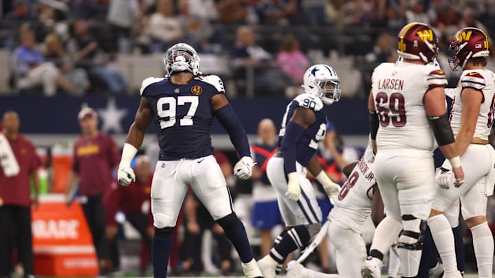 Nov 23, 2023; Arlington, Texas, USA; Dallas Cowboys defensive tackle Osa Odighizuwa (97) celebrates a sack in the second half against the Washington Commanders at AT&T Stadium. Mandatory Credit: Tim Heitman-Imagn Images