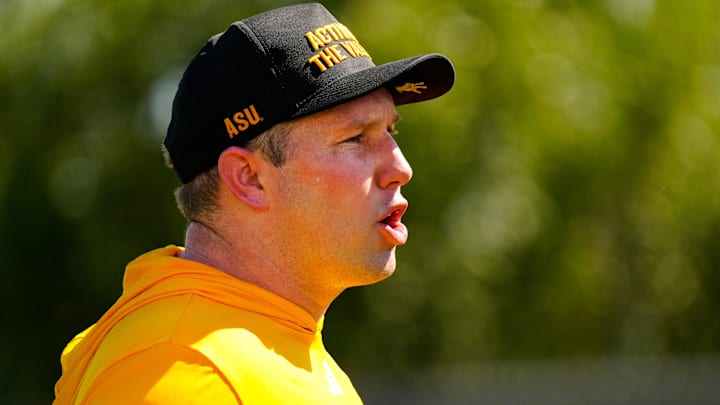 Arizona State head coach Kenny Dillingham yells to his defensive linemen as they run a drill during the first day of fall practice in Tempe, Ariz. on July 30, 2025.