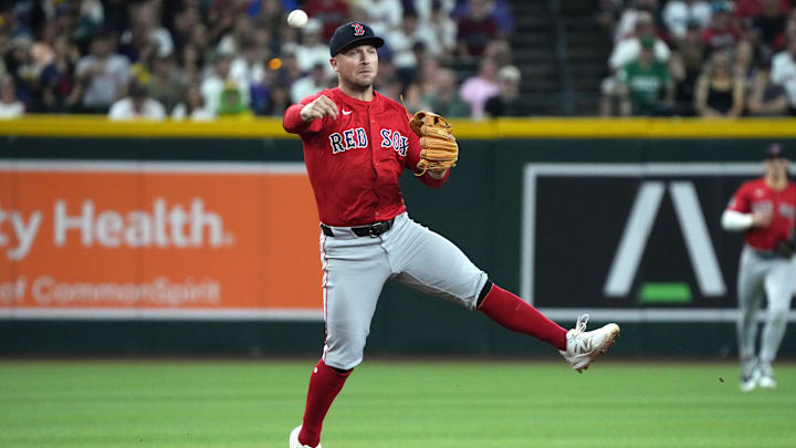 Sep 5, 2025; Phoenix, Arizona, USA; Boston Red Sox third base Alex Bregman (2) mkaes the off balance throw for an out against the Arizona Diamondbacks in the first inning at Chase Field. Mandatory Credit: Rick Scuteri-Imagn Images