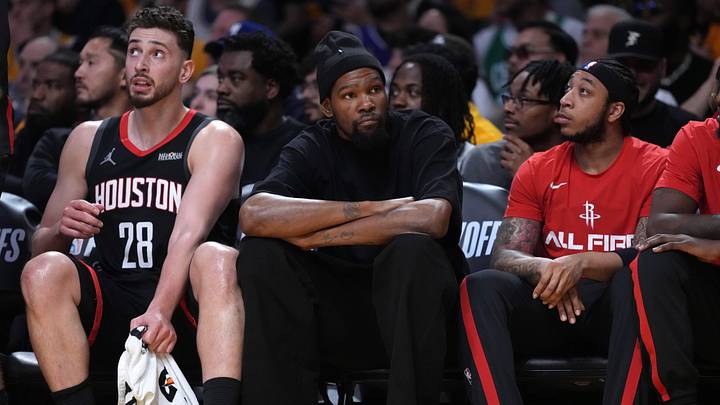 Apr 18, 2026; Los Angeles, California, USA; Houston Rockets center Alperen Sengun (28) and forward Kevin Durant (center) watch during the first half against the Los Angeles Lakers during game one of the first round of the 2026 NBA Playoffs at Crypto.com Arena. Mandatory Credit: Kirby Lee-Imagn Images