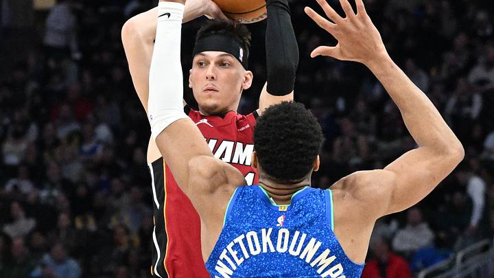 Feb 13, 2024; Milwaukee, Wisconsin, USA; Miami Heat guard Tyler Herro (14) drives against Milwaukee Bucks forward Giannis Antetokounmpo (34) in the second half at Fiserv Forum. Mandatory Credit: Michael McLoone-Imagn Images
