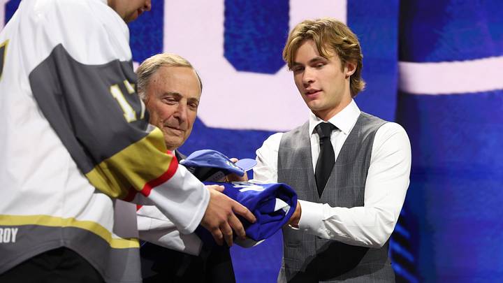 Jun 26, 2026; Buffalo, New York, USA; Gavin McKenna talks to NHL commissioner Gary Bettman after being selected with the first pick in the first round of the 2026 NHL Draft by the Toronto Maple Leafs at KeyBank Center. Mandatory Credit: Timothy T. Ludwig-Imagn Images