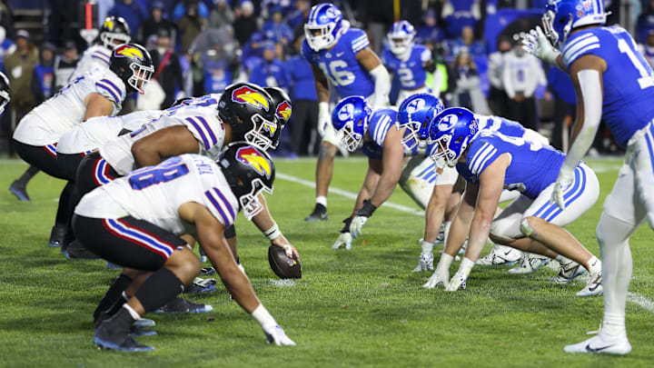 Nov 16, 2024; Provo, Utah, USA; The Kansas Jayhawks offense lines up against the Brigham Young Cougars defense during the fourth quarter at LaVell Edwards Stadium. Mandatory Credit: Rob Gray-Imagn Images
