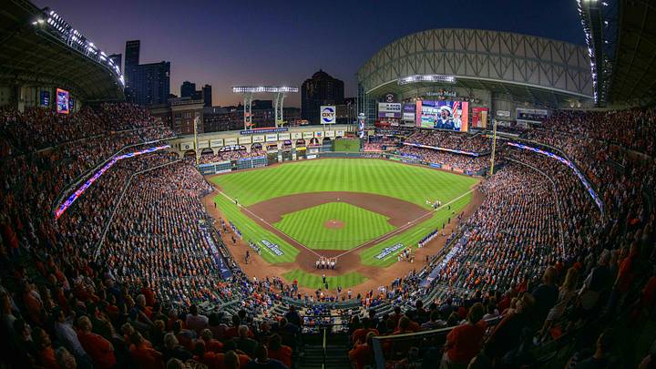 A view of the ballpark, the field, and the sunset during the playing of the national anthem before a World Series game.