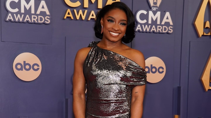 Simone Biles poses on the red carpet before the 58th Annual Country Music Association Awards in Nashville, Tenn., Wednesday, Nov. 20, 2024.