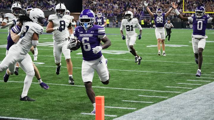 Northwestern Wildcats running back Joseph Himon II (6) runs the ball for a touchdown against the Penn State Nittany Lions during the first quarter at New Ryan Field. 