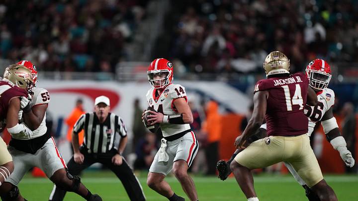 Dec 30, 2023; Miami Gardens, FL, USA; Georgia Bulldogs quarterback Gunner Stockton (14) drops back to passFlorida State Seminoles during the second half in the 2023 Orange Bowl at Hard Rock Stadium. Mandatory Credit: Jasen Vinlove-Imagn Images