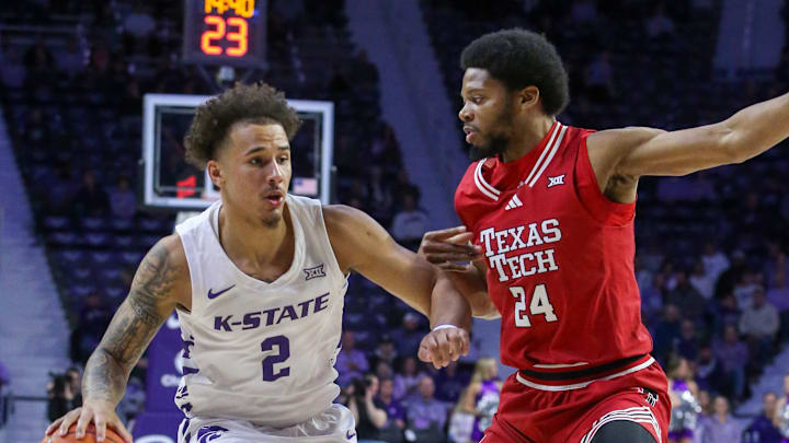 Jan 14, 2025; Manhattan, Kansas, USA; Kansas State Wildcats guard Max Jones (2) is guarded by Texas Tech Red Raiders guard Keerwin Walton (24) during the first half at Bramlage Coliseum. Mandatory Credit: Scott Sewell-Imagn Images