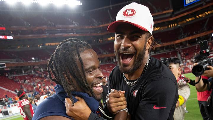 Denver Broncos linebacker Dre Greenlaw (left) and San Francisco 49ers linebacker Fred Warner (right)