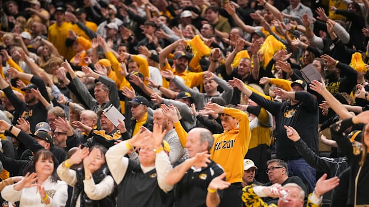 Feb 25, 2025; Columbia, Missouri, USA; Missouri Tigers fans wave arms to the Missouri Waltz during the first half of the game against the South Carolina Gamecocks at Mizzou Arena. Mandatory Credit: Denny Medley-Imagn Images