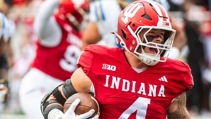Indiana linebacker Aiden Fisher returns an interception for a touchdown Oct. 25, 2025, versus UCLA at Memorial Stadium. Indiana linebacker Aiden Fisher returns an interception for a touchdown Oct. 25, 2025, versus UCLA at Memorial Stadium.