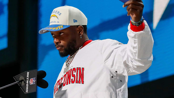 Former Los Angeles Chargers running back Melvin Gordon announces the team’s selection with the 86th overall pick during the third round of the 2025 NFL Draft on Friday, April 25, 2025, at Lambeau Field in Green Bay, Wisconsin.