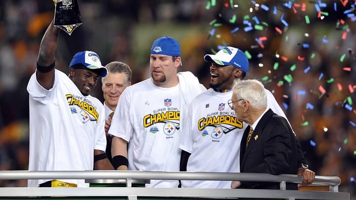 Feb 1, 2009; Tampa, FL, USA; Pittsburgh Steelers wide receiver Santonio Holmes (left) holds up the Vince Lombardi trophy and celebrates with quarterback Ben Roethlisberger (center) and head coach Mike Tomlin (second right) after defeating the Arizona Cardinals 27-24 in Super Bowl XLIII at Raymond James Stadium.  Mandatory Credit: Matt Cashore-USA TODAY Sports