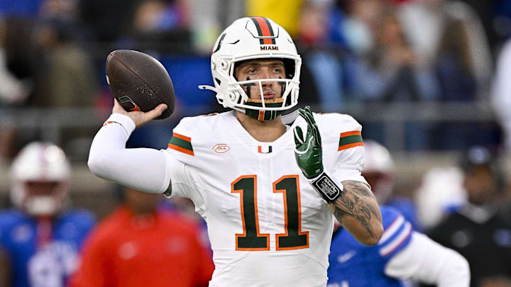 Nov 1, 2025; Dallas, Texas, USA;  Miami Hurricanes quarterback Carson Beck (11) drops back to pass against the SMU Mustangs during the first quarter at Gerald J. Ford Stadium. Mandatory Credit: Jerome Miron-Imagn Images