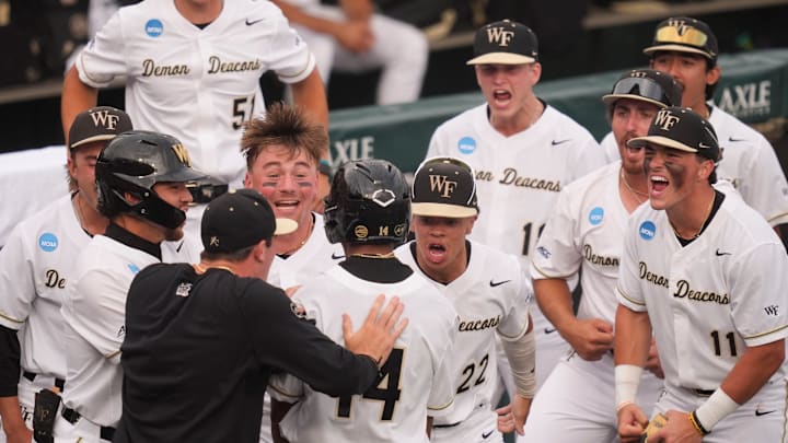 Wake Forest celebrates Javar Williams (14) 2-run home run at the NCAA college baseball Knoxville Regional final against Tennessee on June 1, 2025, in Knoxville, Tenn.