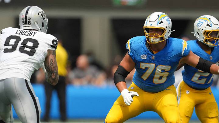 Sep 8, 2024; Inglewood, California, USA; Los Angeles Chargers offensive tackle Joe Alt (76) defends against Las Vegas Raiders defensive end Maxx Crosby (98) and defensive tackle Christian Wilkins (94) in the first half at SoFi Stadium. Mandatory Credit: Kirby Lee-Imagn Images Sep 8, 2024; Inglewood, California, USA; Los Angeles Chargers offensive tackle Joe Alt (76) defends against Las Vegas Raiders defensive end Maxx Crosby (98) and defensive tackle Christian Wilkins (94) in the first half at SoFi Stadium. Mandatory Credit: Kirby Lee-Imagn Images