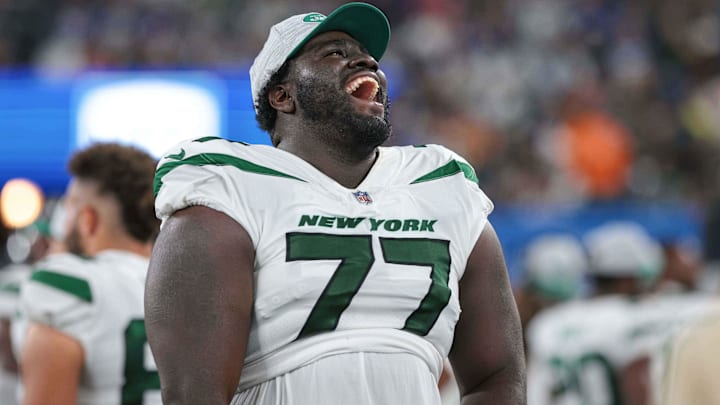 Aug 14, 2021; East Rutherford, New Jersey, USA; New York Jets offensive tackle Mekhi Becton (77)