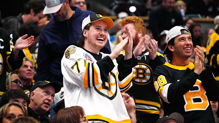 Oct 16, 2024; Denver, Colorado, USA; Boston Bruins fans celebrate a goal scored in the second period against the Colorado Avalanche at Ball Arena. Mandatory Credit: Ron Chenoy-Imagn Images Oct 16, 2024; Denver, Colorado, USA; Boston Bruins fans celebrate a goal scored in the second period against the Colorado Avalanche at Ball Arena. Mandatory Credit: Ron Chenoy-Imagn Images