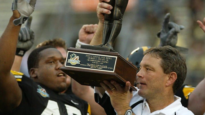 Jan. 1, 2005: Kirk Ferentz celebrates the Capital One Bowl win with Jonathan Babineaux (45) and other team members.

Kirk Ferentz Jonathan Babineaux