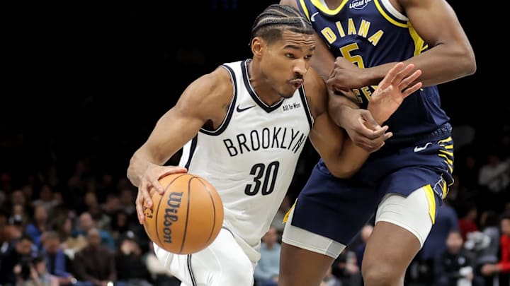 Feb 11, 2026; Brooklyn, New York, USA; Brooklyn Nets guard Ochai Agbaji (30) drives to the basket against Indiana Pacers forward Jarace Walker (5) during the second quarter at Barclays Center. Mandatory Credit: Brad Penner-Imagn Images