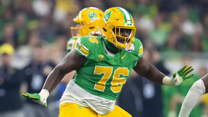 Jan 1, 2024; Glendale, AZ, USA; Oregon Ducks offensive lineman Josh Conerly Jr. (76) against the Liberty Flames during the 2024 Fiesta Bowl at State Farm Stadium. Mandatory Credit: Mark J. Rebilas-Imagn Images