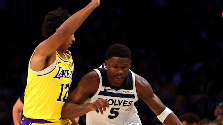 Oct 22, 2024; Los Angeles, California, USA; Minnesota Timberwolves guard Anthony Edwards (5) drives against Los Angeles Lakers guard Max Christie (12) during the fourth quarter at Crypto.com Arena. Mandatory Credit: Jason Parkhurst-Imagn Images Oct 22, 2024; Los Angeles, California, USA; Minnesota Timberwolves guard Anthony Edwards (5) drives against Los Angeles Lakers guard Max Christie (12) during the fourth quarter at Crypto.com Arena. Mandatory Credit: Jason Parkhurst-Imagn Images